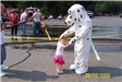 Fire Dalmatian Mascot Character Dancing with a Little Girl 1