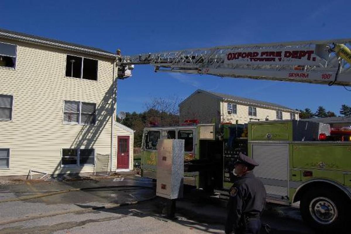 Firefighter Being Lifted to the Third Floor with a Fire Ladder