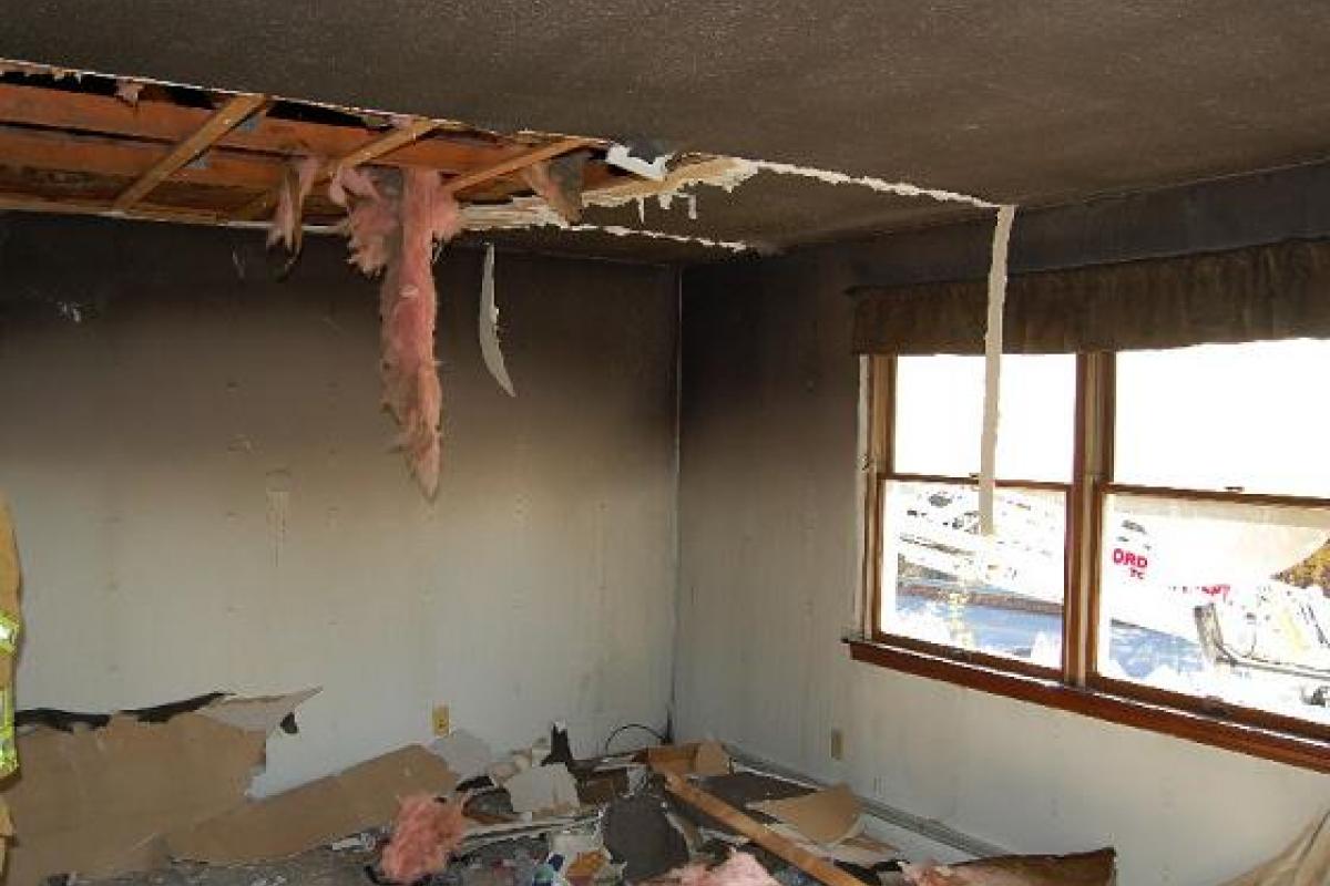 Destroyed Ceiling with Insulation Falling From It