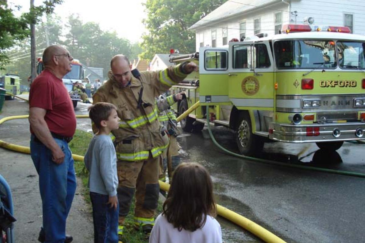 Nearby Citizens View the Structure Fire