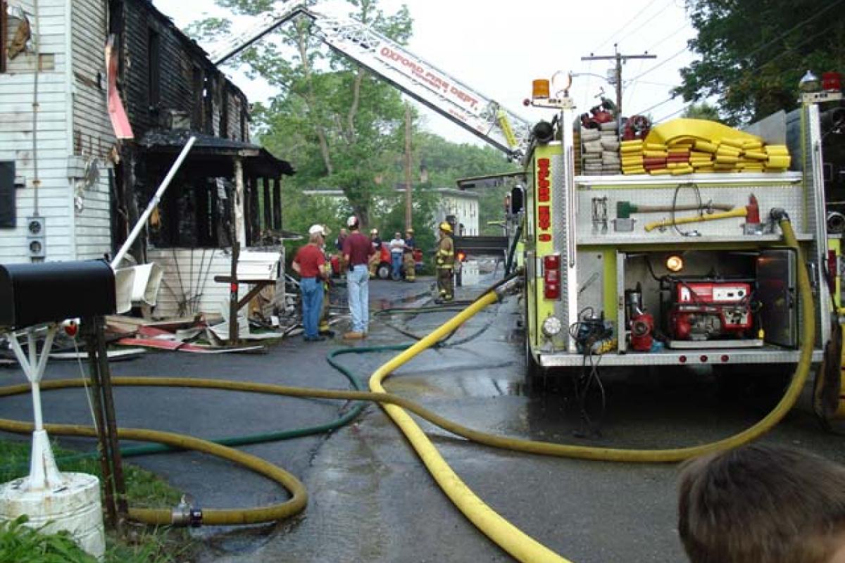 Fire Ladder and and Firefighters at the Scene of the Fire 1