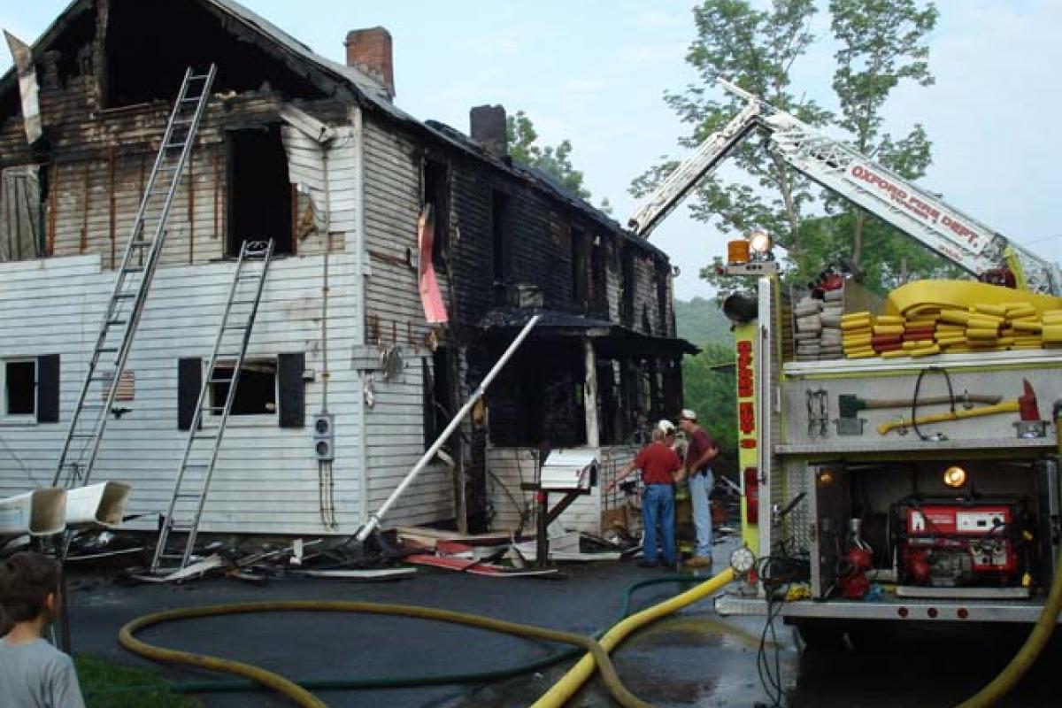 Fire Ladder and and Firefighters at the Scene of the Fire 2