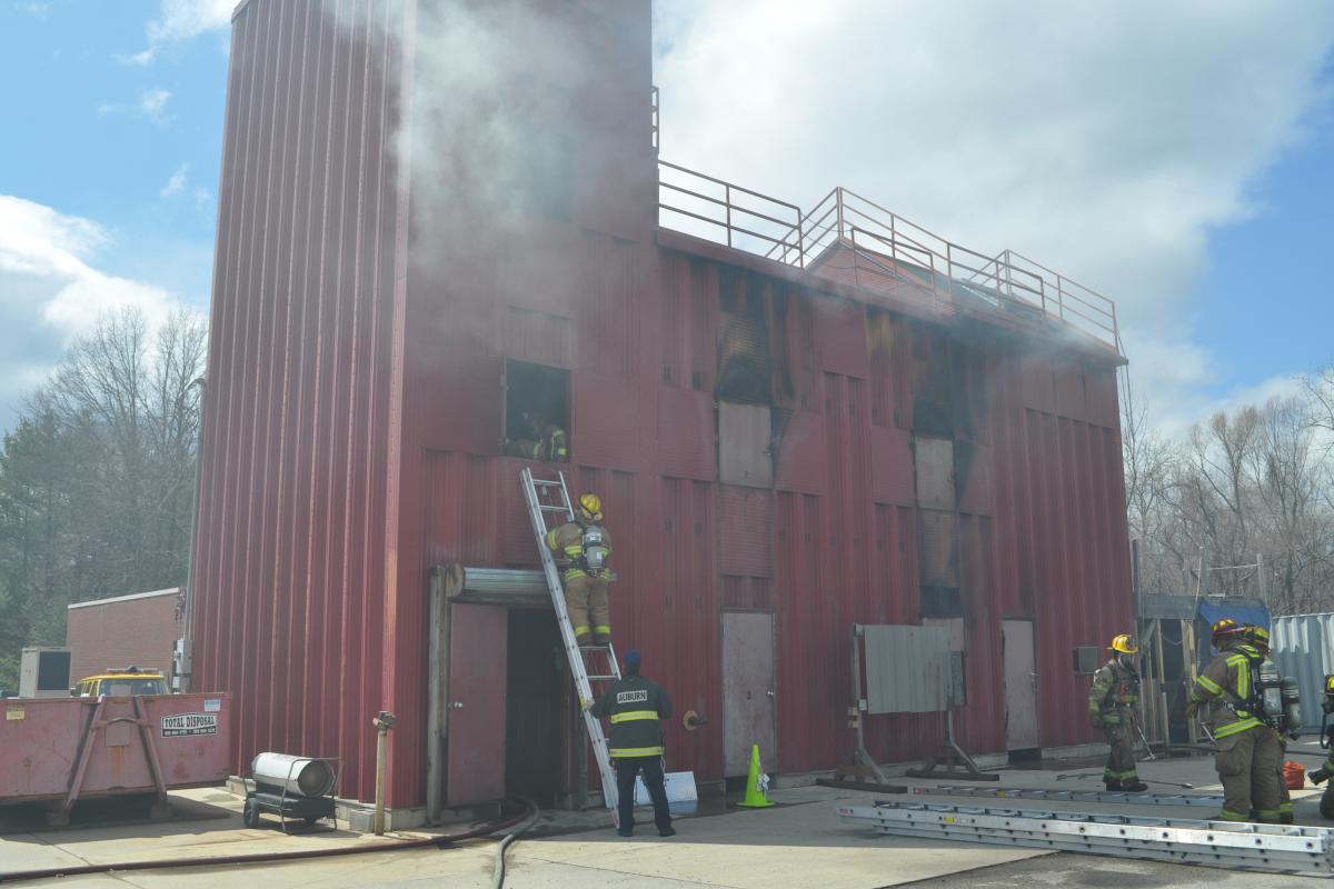 Trainee Crews Entering a Mock Structure Fire