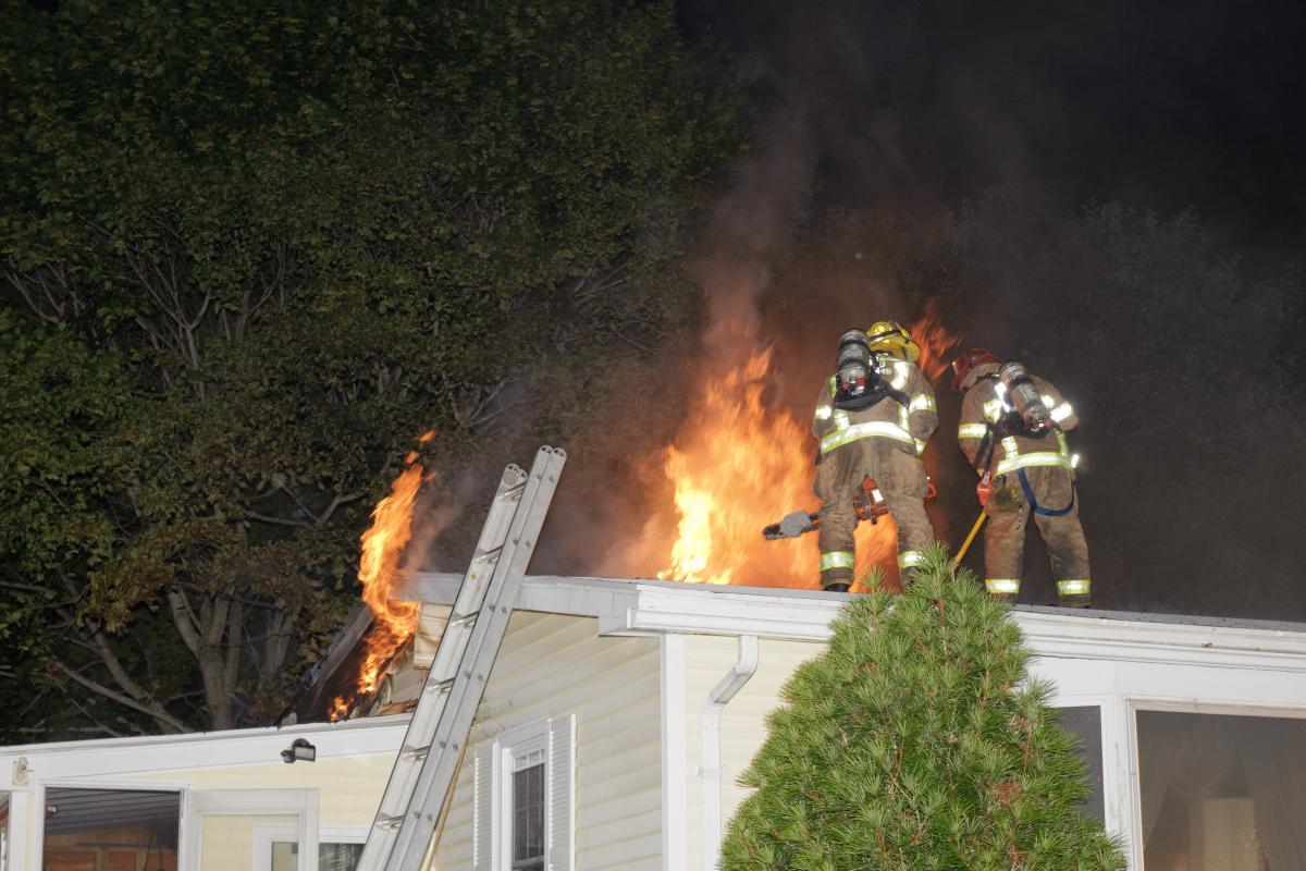 Crew of Trainees on the Roof of a Structure Fire